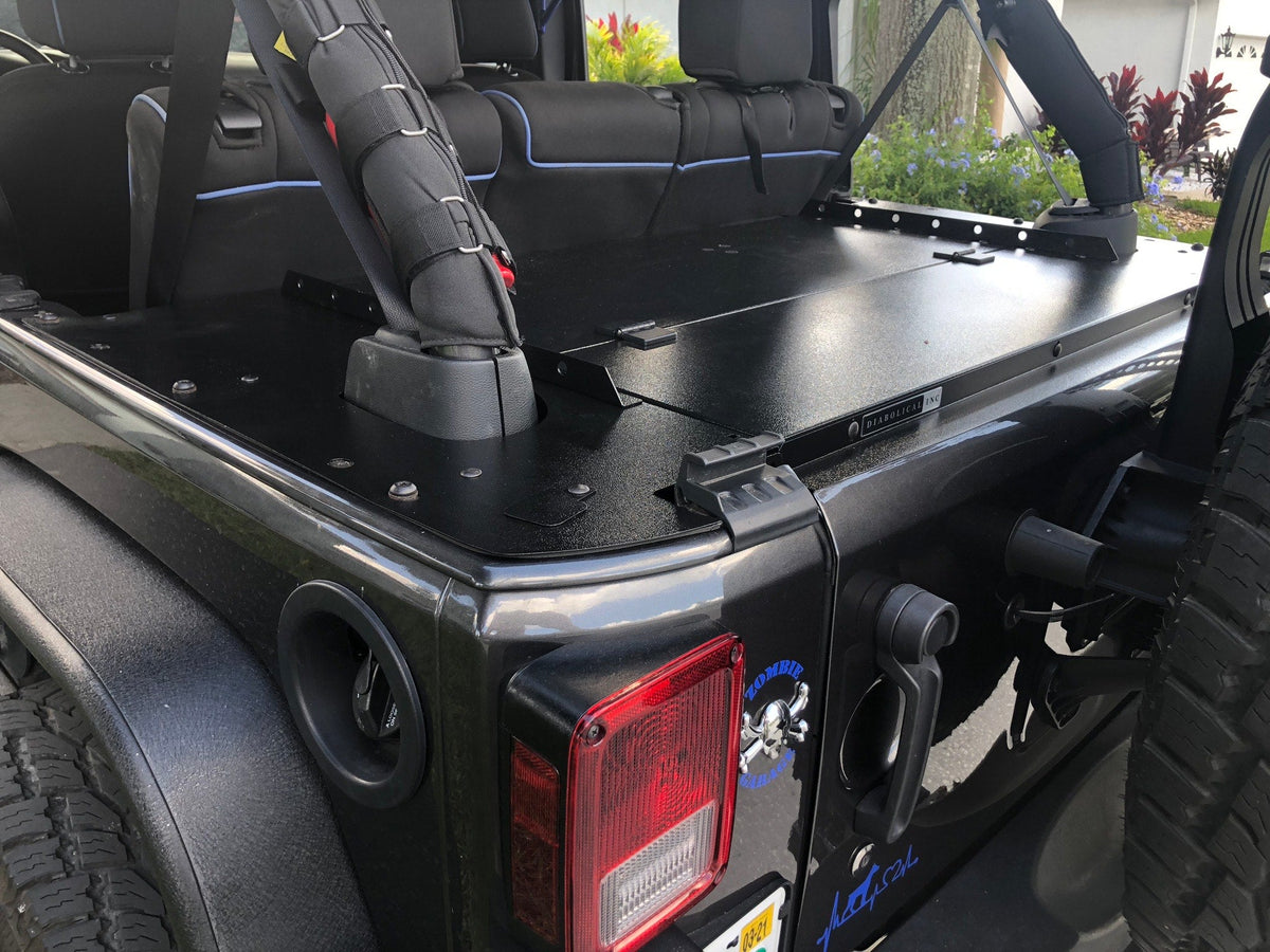 Black Jeep JKU with the top off and the Slipstream enclosure closed over the cargo area