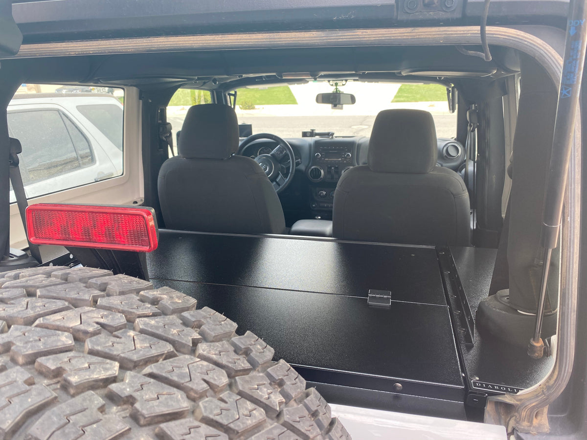 View through the open tailgate to the closed Slipstream and the front seats