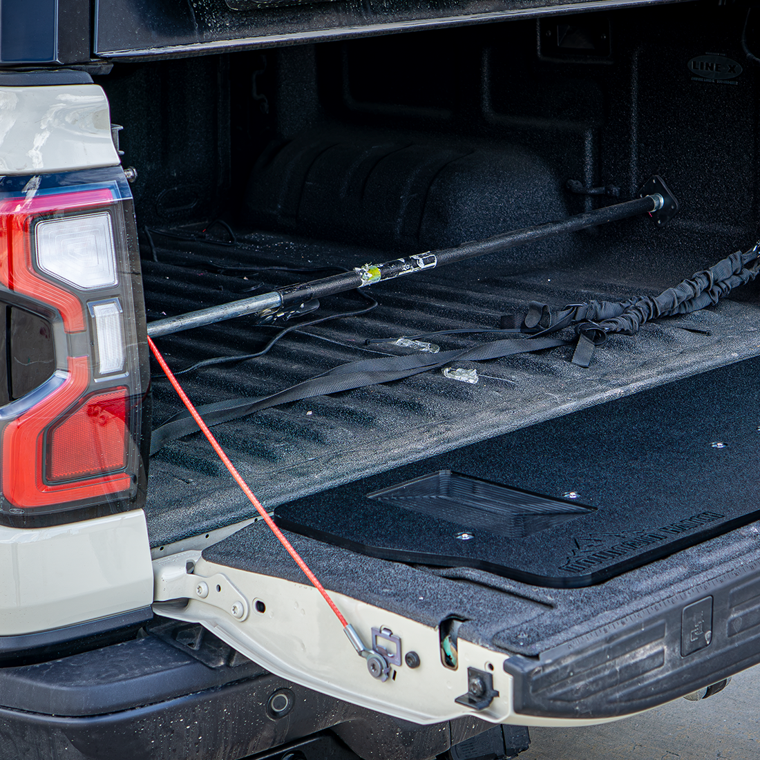 Mountain Hatch tailgate table installed on a 2024+ Ford Ranger Raptor tailgate with a snowy bed behind it