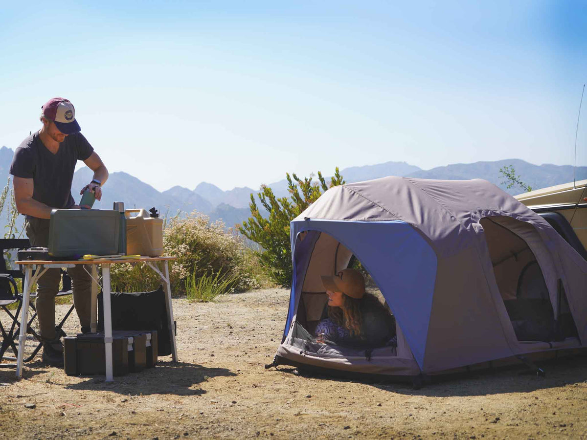 C6 Rev Rooftop Tent X (Element) – people relaxing at a camp with a ground tent