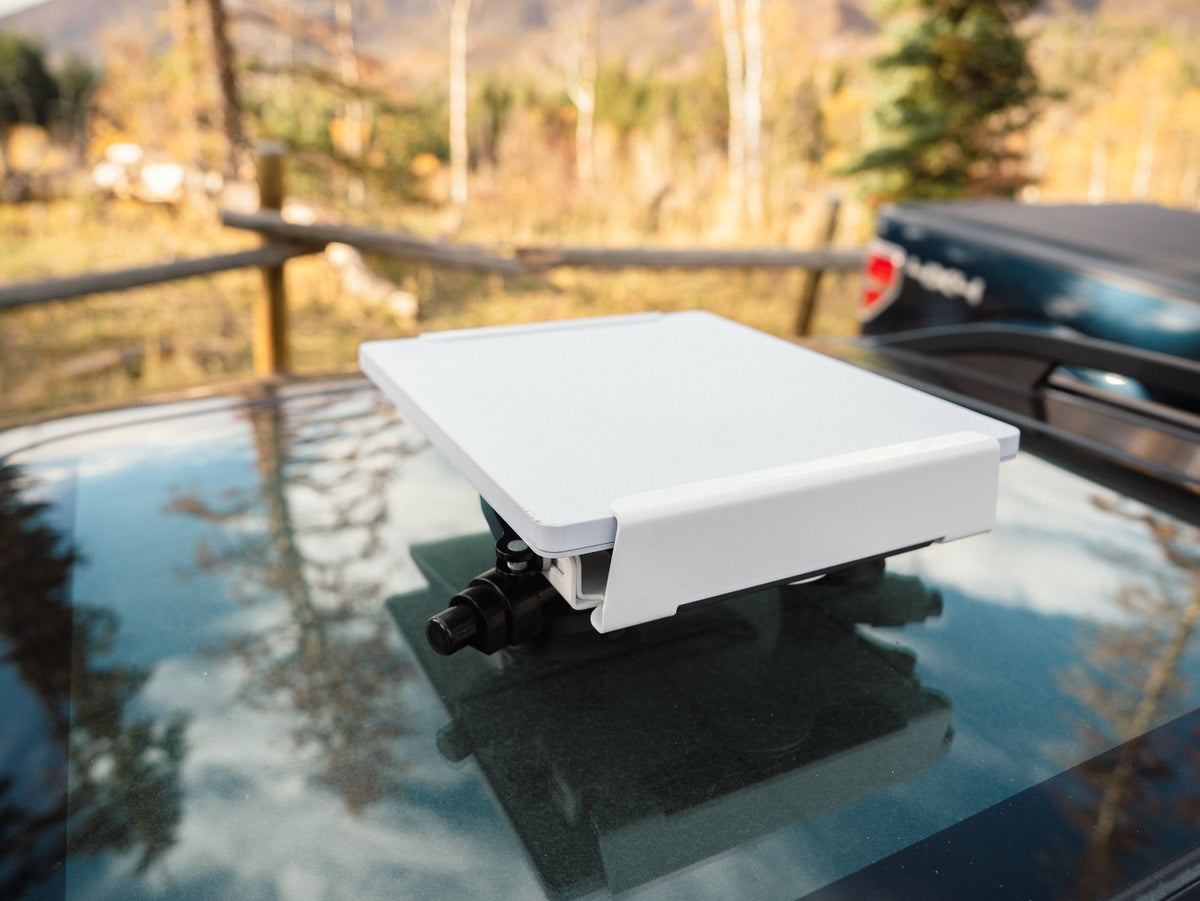 White Revolink mount on suction cups on a glass sunroof