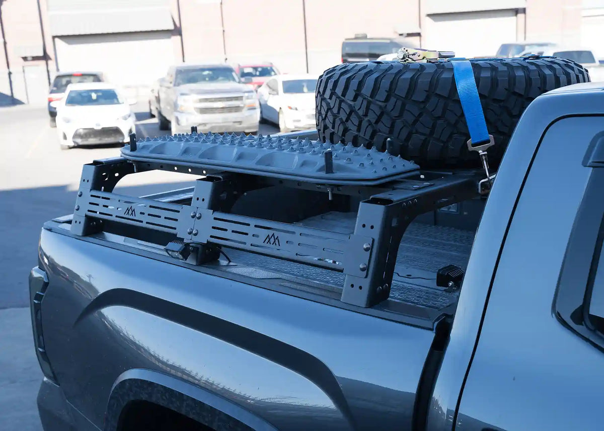 Toyota Tundra Mid Height bed rack with traction boards mounted via the dogbone traction board mount