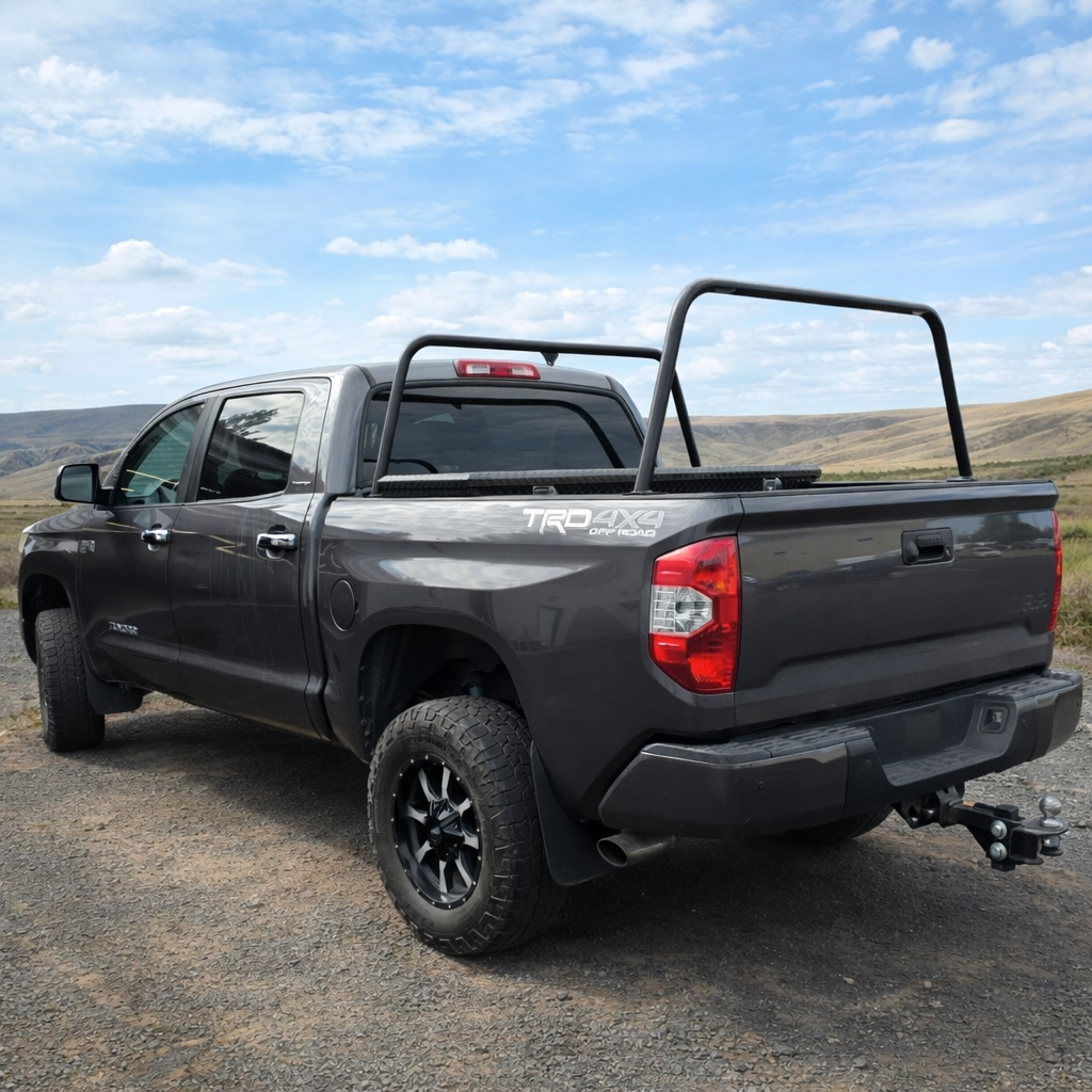 Gray Toyota Tundra TRD with low HMOR bed bars, rear quarter view