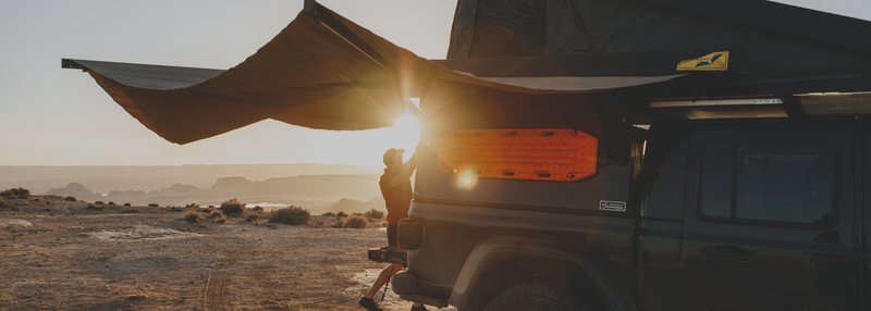 Assorted vehicle awning mounts and accessories for secure overlanding setups.