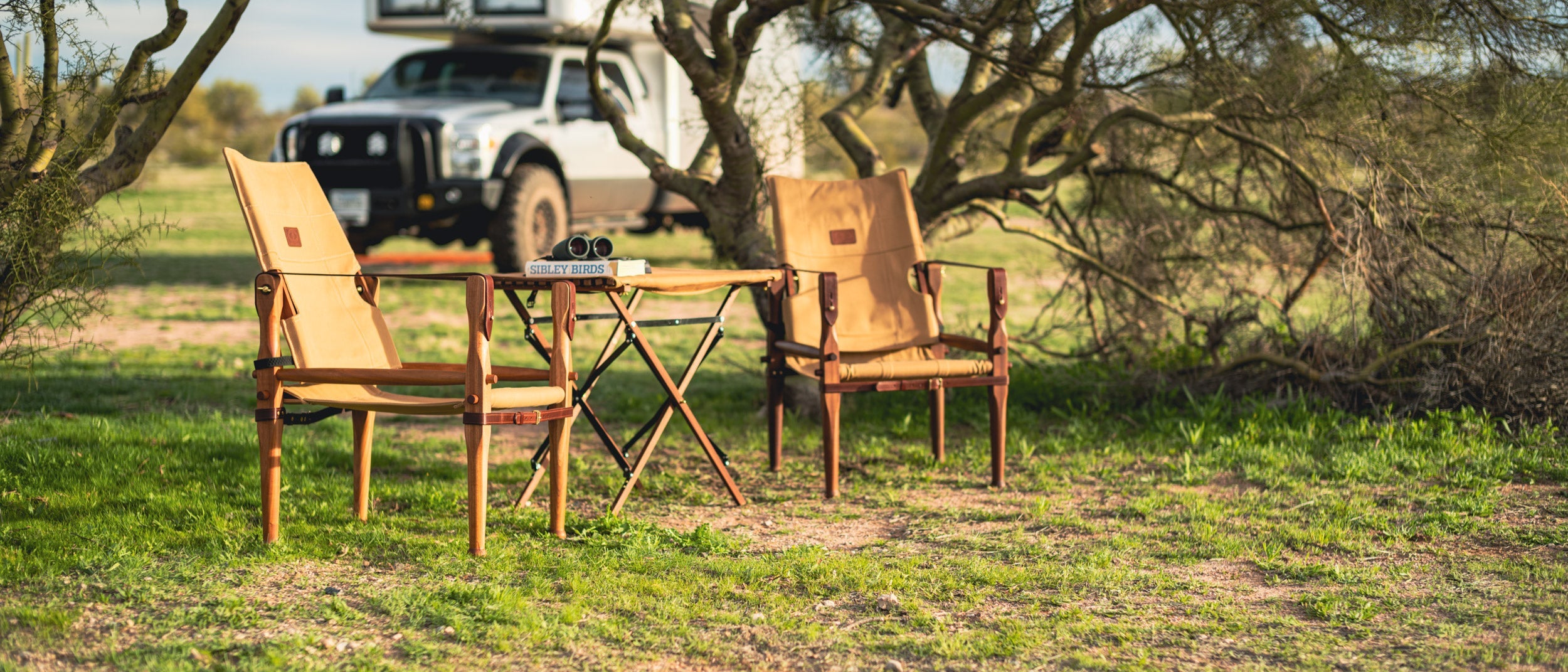 Snow Peak Low Beach Chairs in camp scene with earthroamer