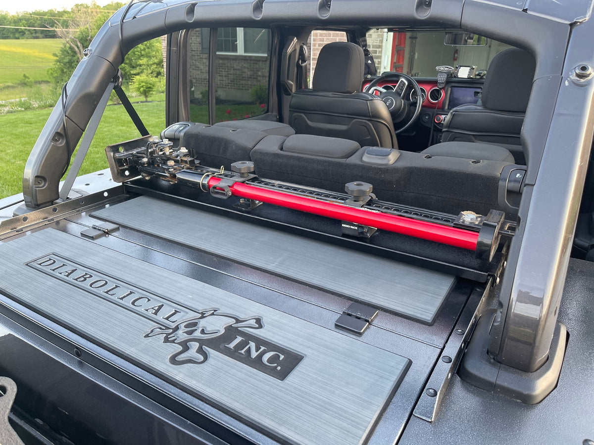 Gray logo pads under Rail Racks and a Hi-Lift jack on a Slipstream