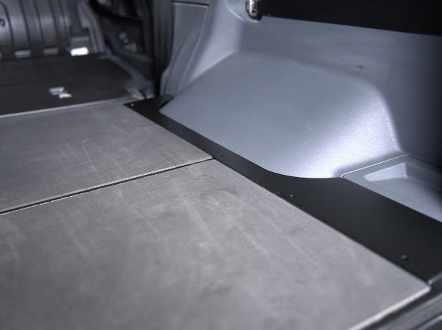 Close view of the foam-topped leveling panel against the Grenadier side trim