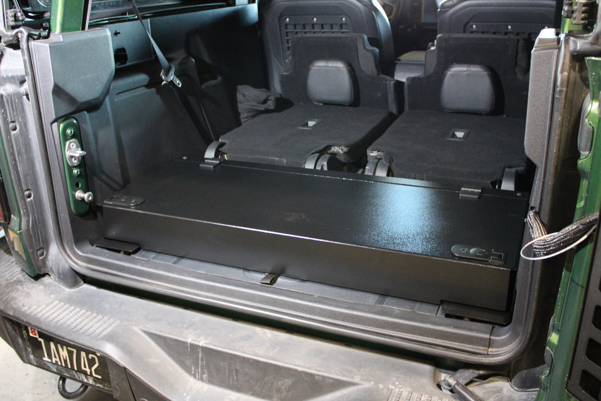 Green Bronco cargo area with the Stage closed and the seats folded flat