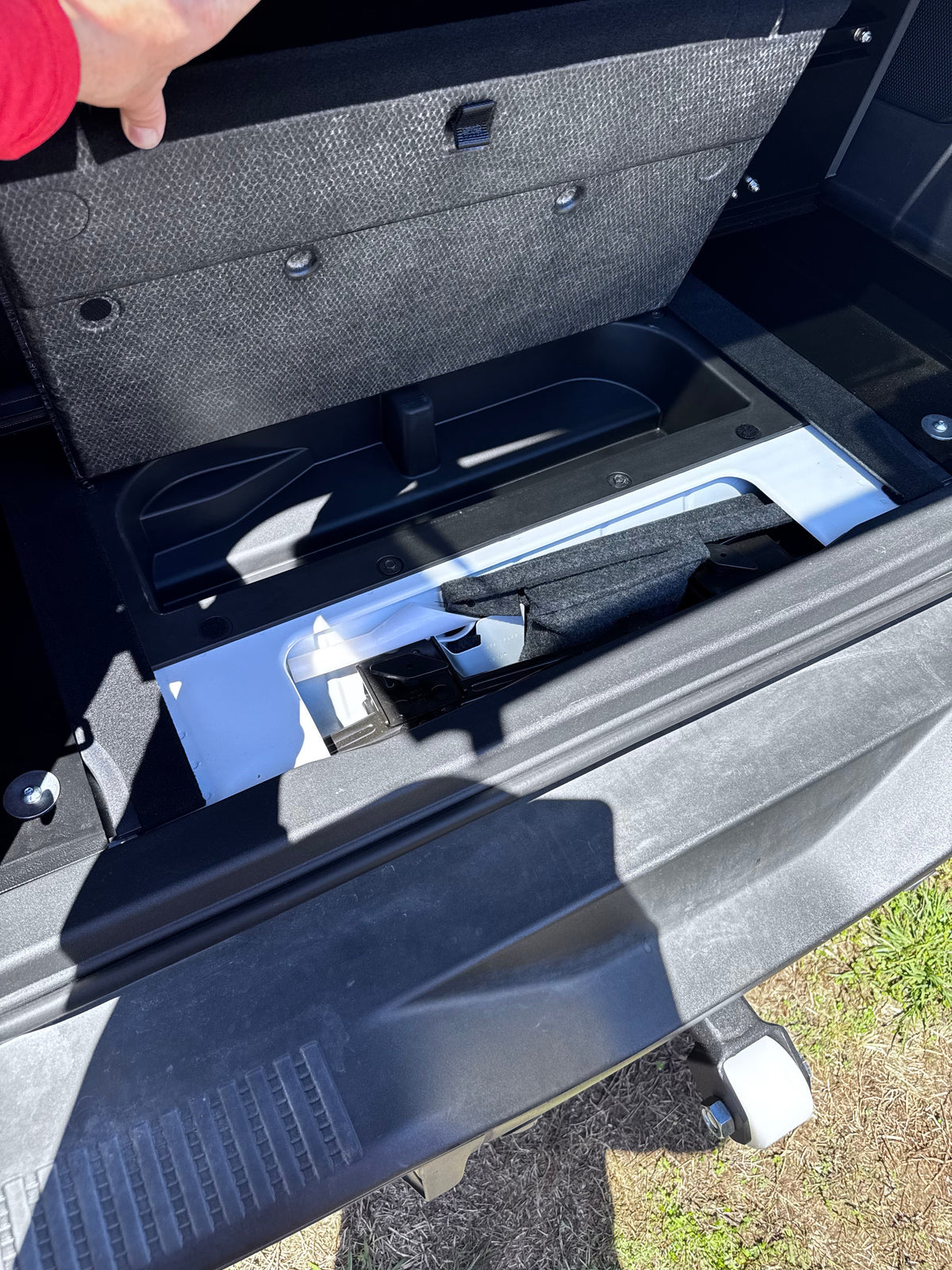 Stage top hinged up to reveal the Bronco underfloor storage