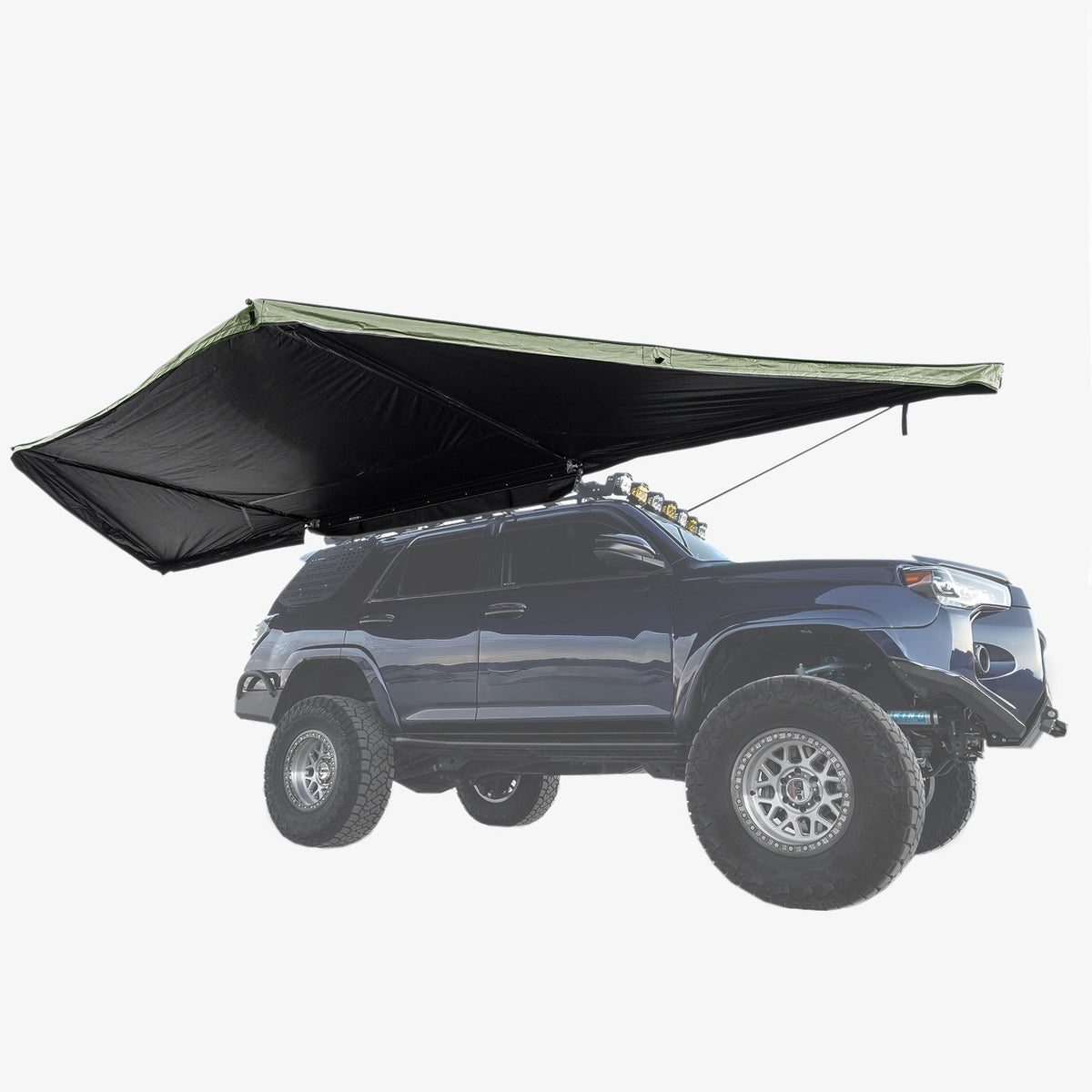 Side view of the 180° awning extended from a dark SUV