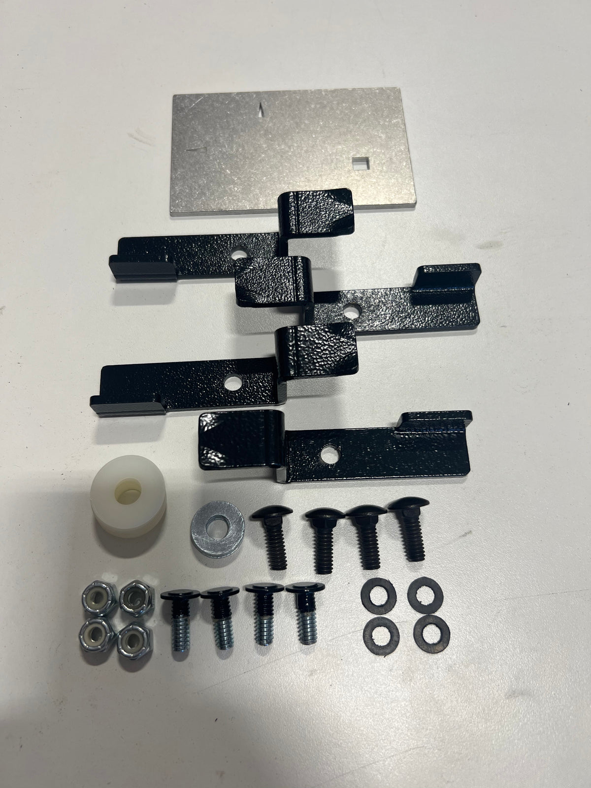 Bronco retro kit components laid out with the template plate at the top
