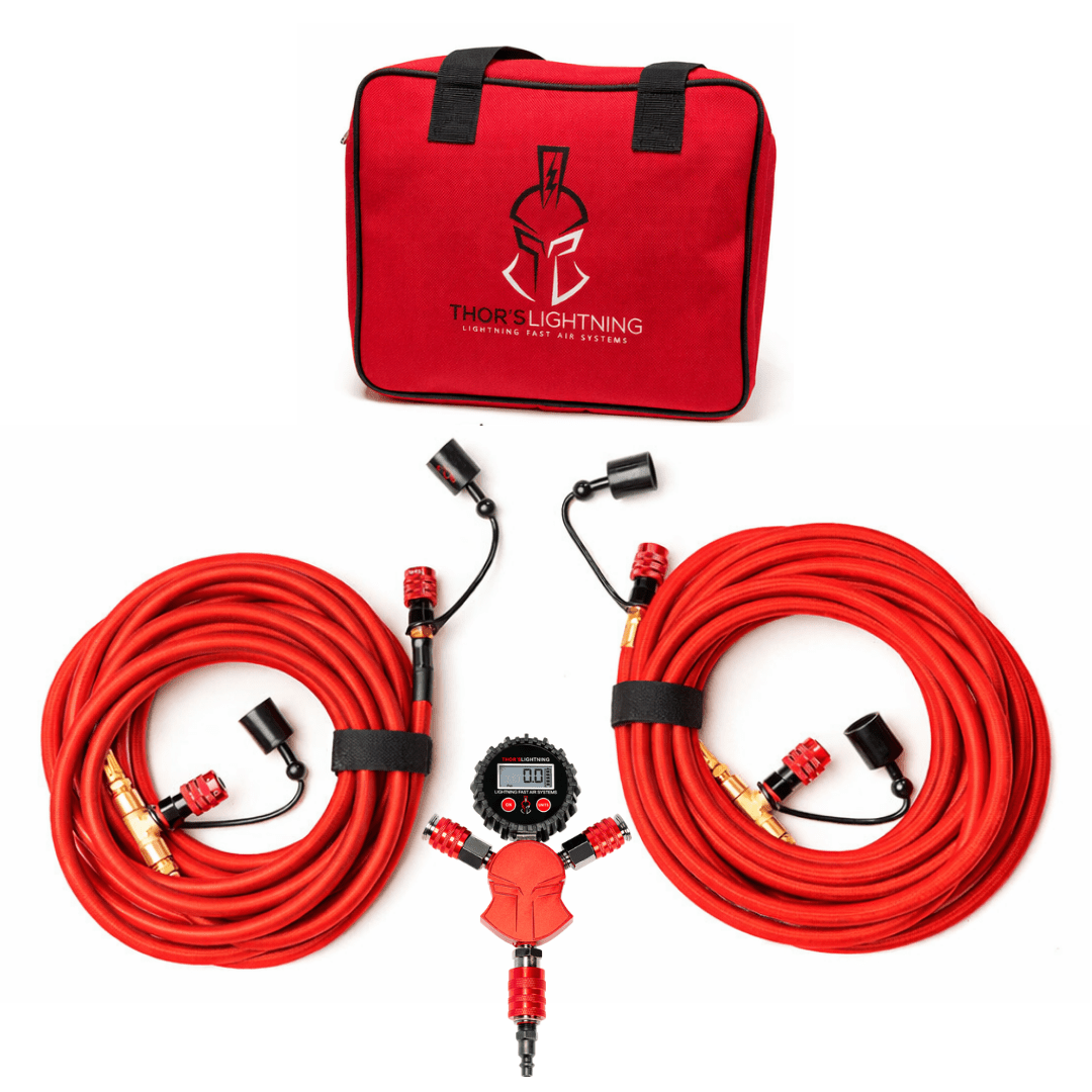 Rapid Multi-Tire Air System kit in red: carrying bag, two coiled StrikeShield braided hoses, and Standard Hammer Manifold with four lock-on air chucks