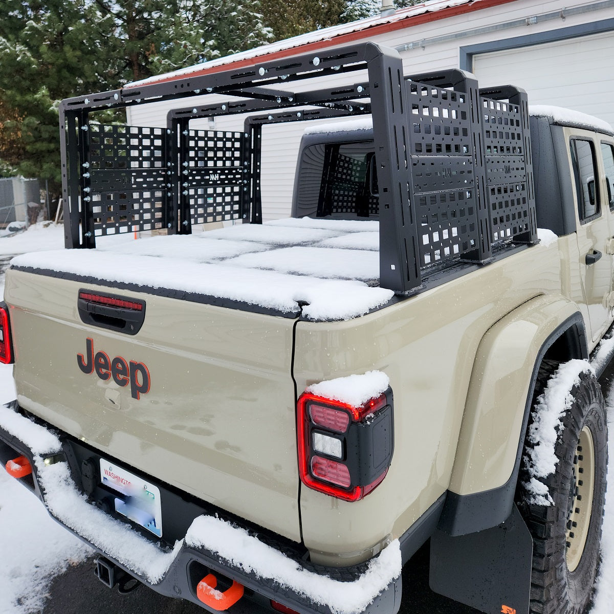 Tan Gladiator with tall black ROCK-IT rack in the snow