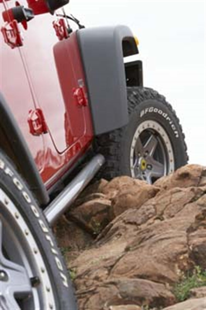 ARB rock sliders fitted along the rocker panel of a 4-door Jeep Wrangler JK