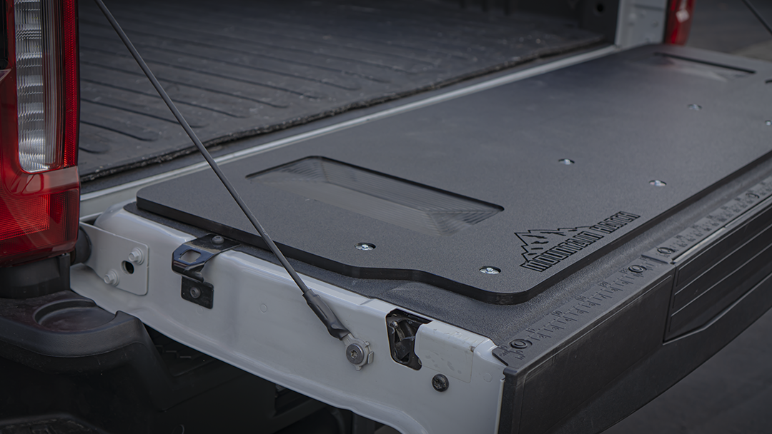 Driver-side view of the Mountain Hatch panel on a 2023+ Super Duty tailgate with spray-in bedliner