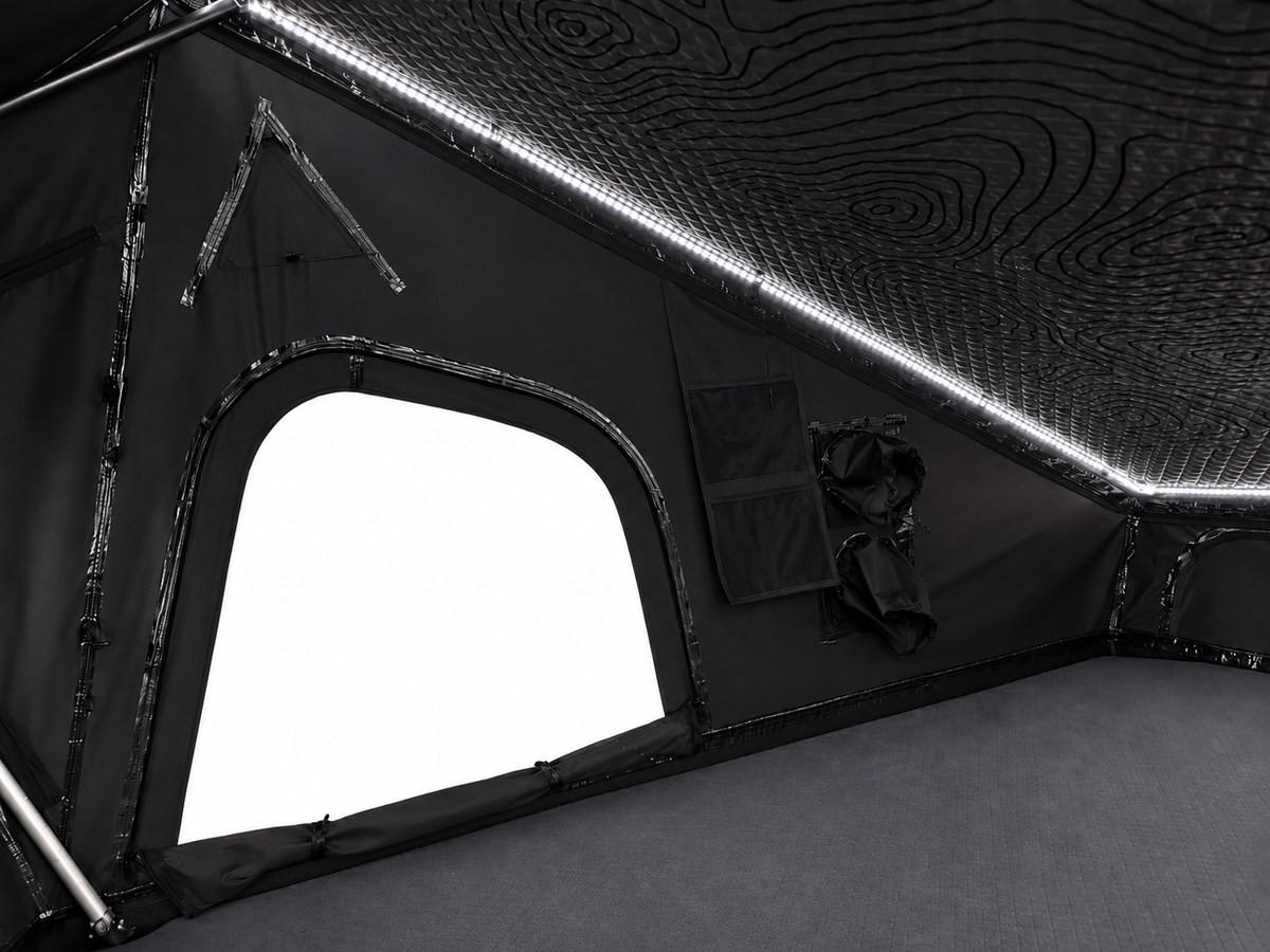 Interior of the Dark Rogue tent showing a window opening, a storage pocket and white LED strip lighting along the ceiling