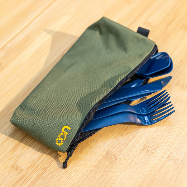 Close-up of the olive green utensil case with utensils tucked partially inside