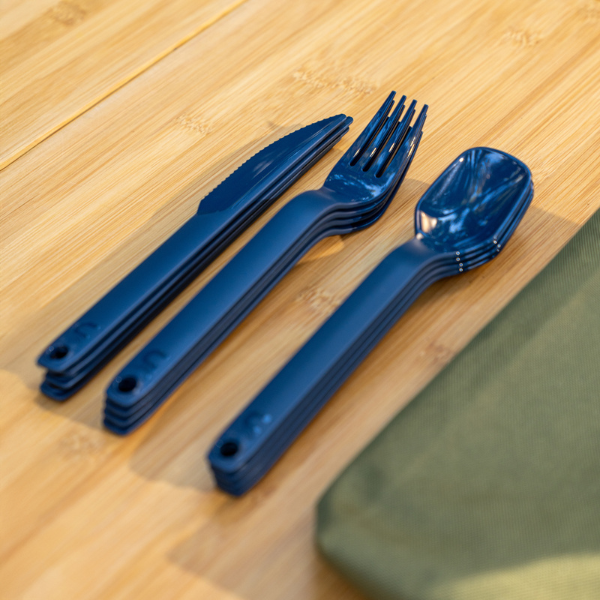 UCO ECO utensil set and its case laid flat on a wood surface