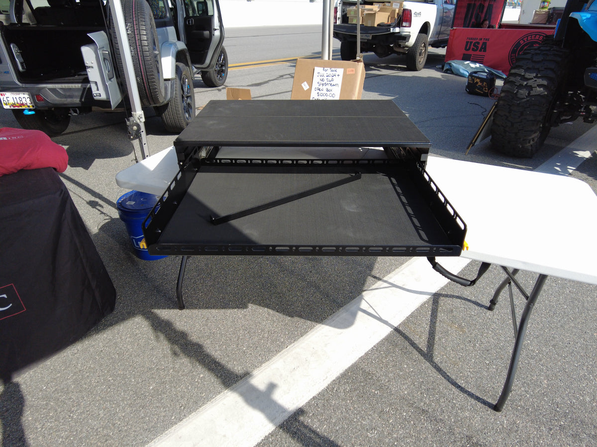 JLU drawer top on its slide floor at an outdoor event, tray extended