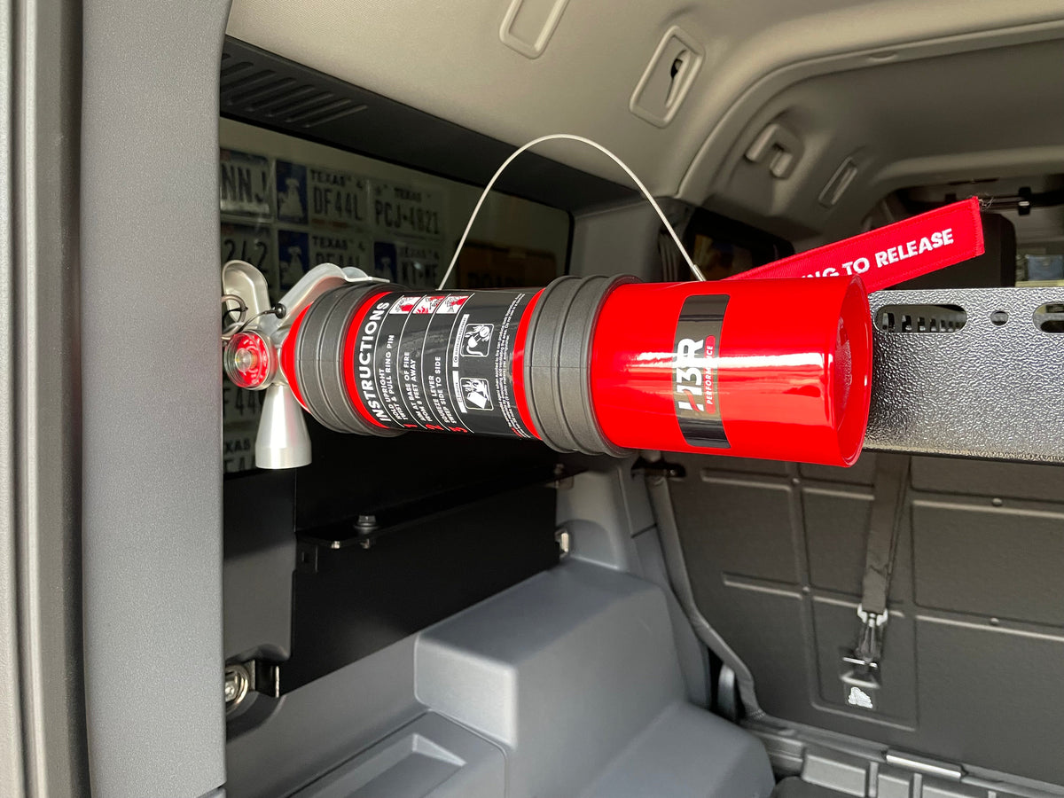 Fire extinguisher strapped to the crossbar in the Grenadier cargo area