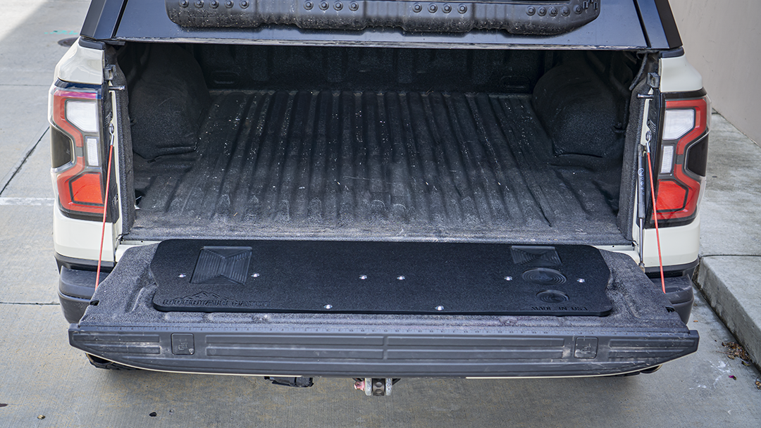 2024+ Ford Ranger Raptor from the rear with its tailgate down and the Mountain Hatch panel installed