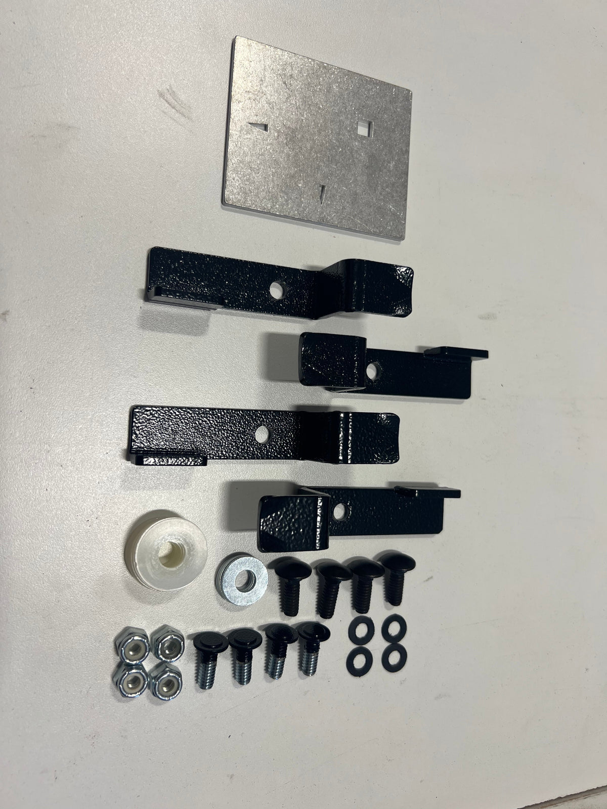 Jeep retro kit parts arranged vertically with the drilling template at top