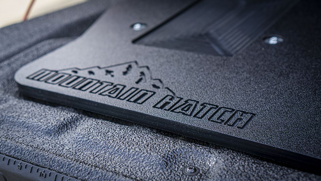 Close-up of the Mountain Hatch logo stamped into the textured HDPE on the 2024+ Ranger panel