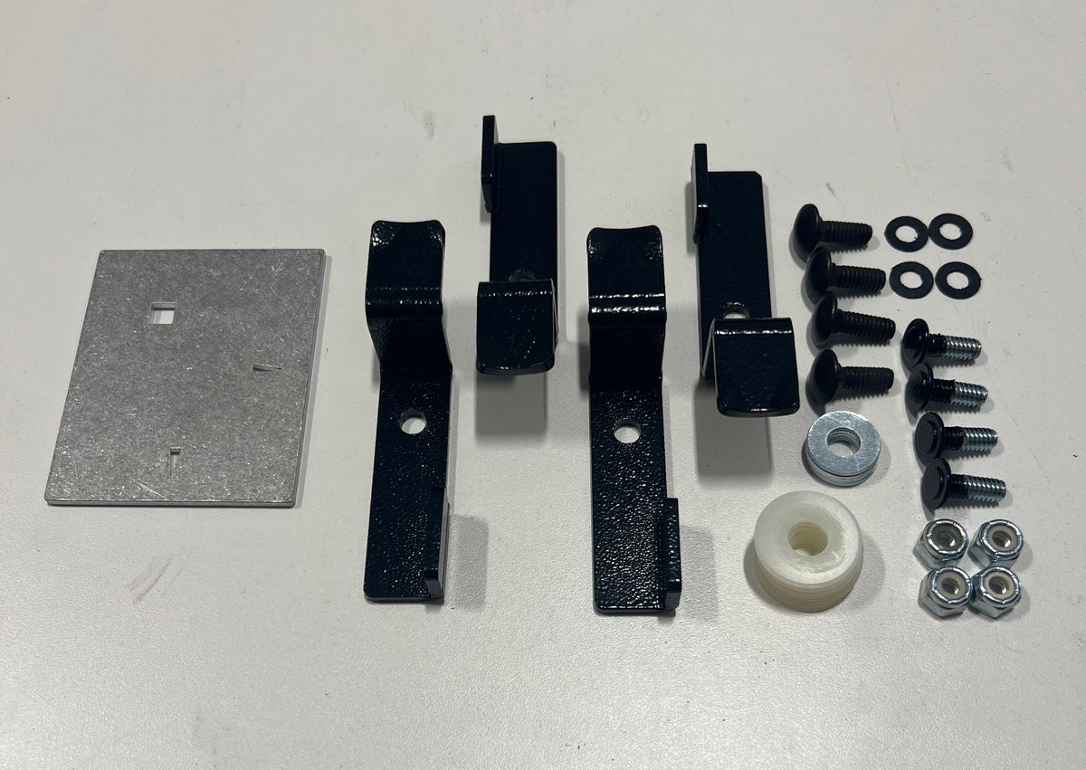 Jeep spin lever retro kit laid out: template plate, four lever brackets, bolts, nuts and spacer