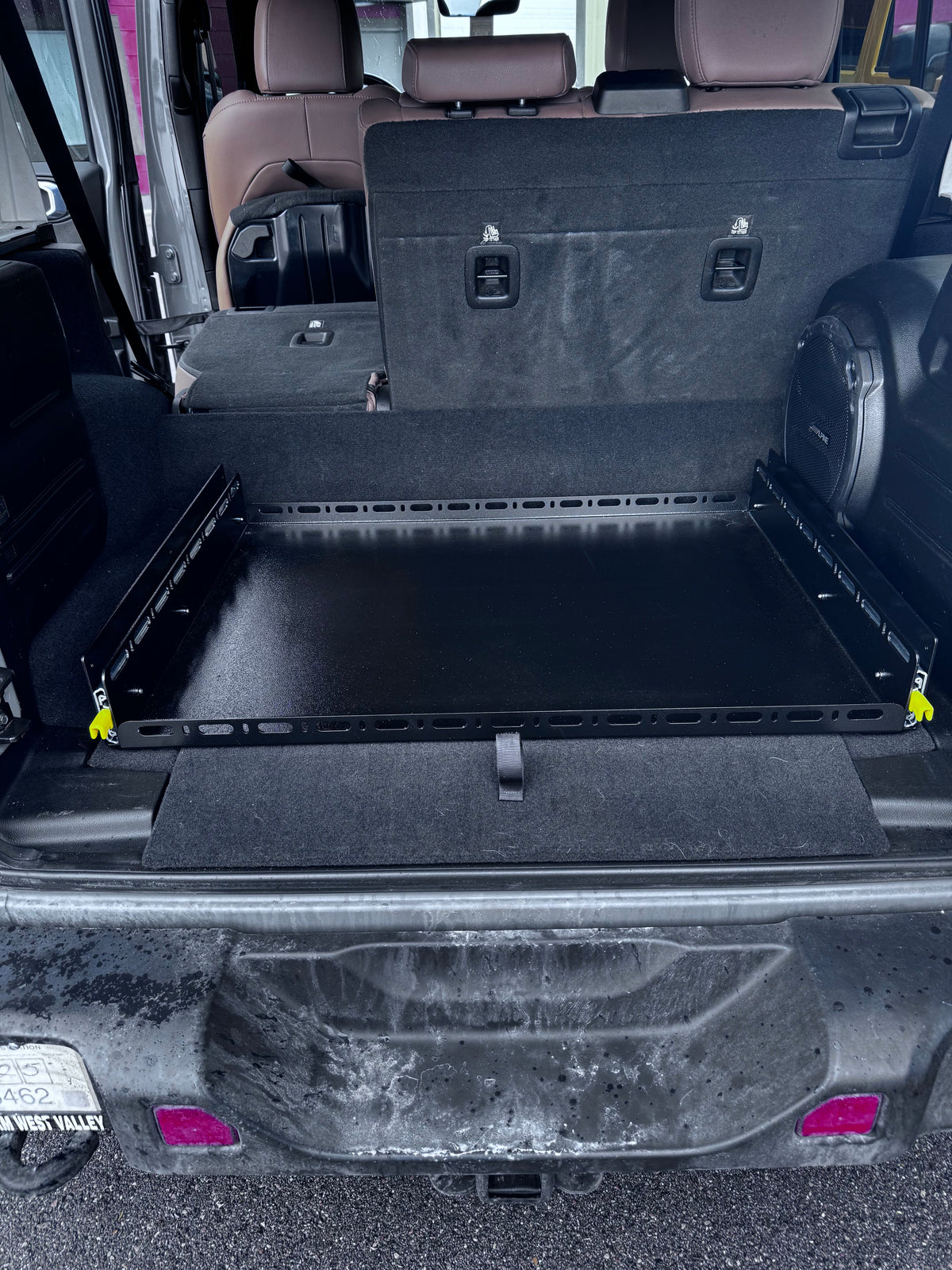 JLU Slide Floor 2.0 installed, wider view with the tailgate open