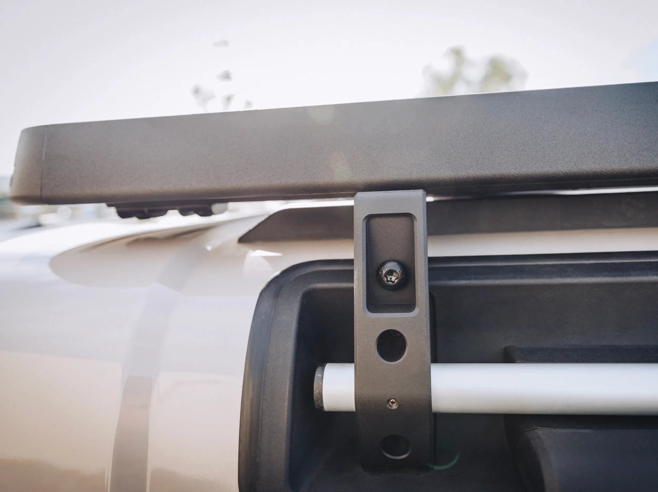 CLOSE UP VIEW OF INEOS GRENADIER FULL LENGTH ROOF RACK BRACKET
