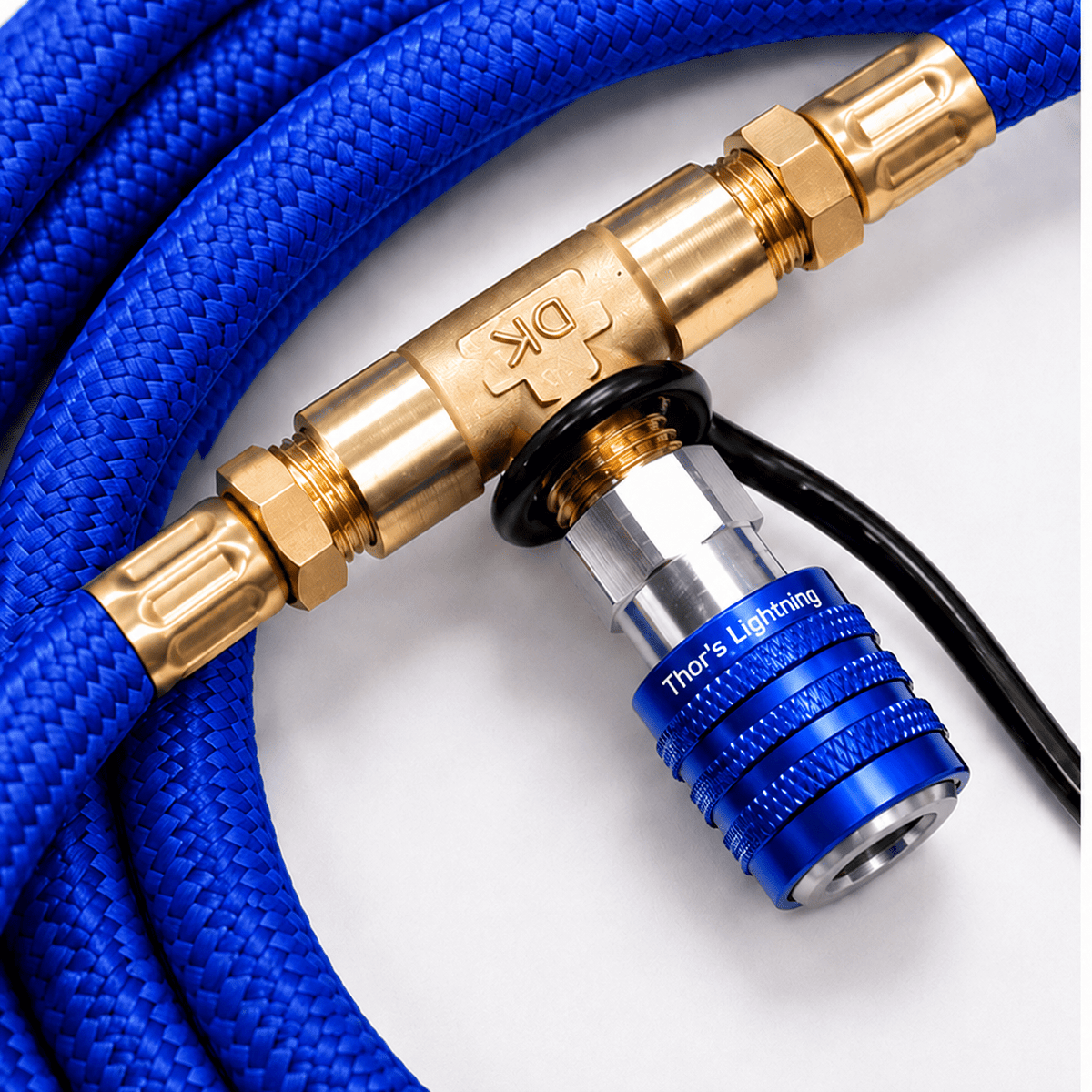 Close-up of the blue Rapid Multi-Tire Air System's manifold ball valve and hose connections