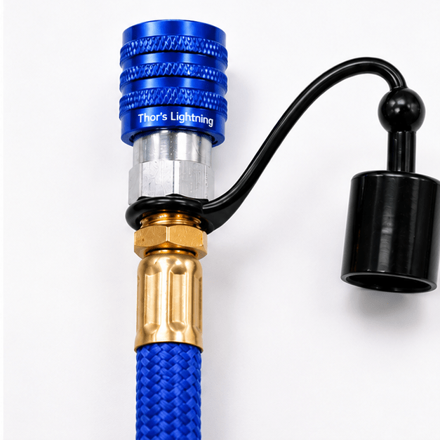 Close-up of a blue StrikeShield braided hose's quick-connect fitting and dust cap