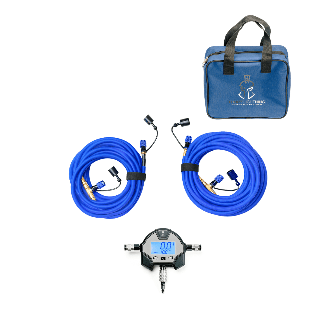 Blue Rapid Multi-Tire Air System kit with TotalControl Hammer Manifold showing digital target-pressure readout, carrying bag, and coiled hoses