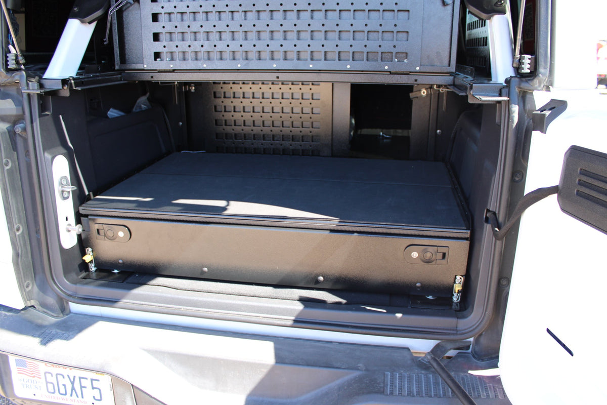 Bronco drawer system closed under a MOLLE wall, tailgate open