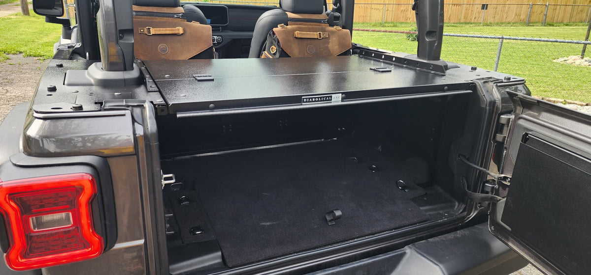 Gray JL 2-door with the tailgate open showing the Slipstream compartment