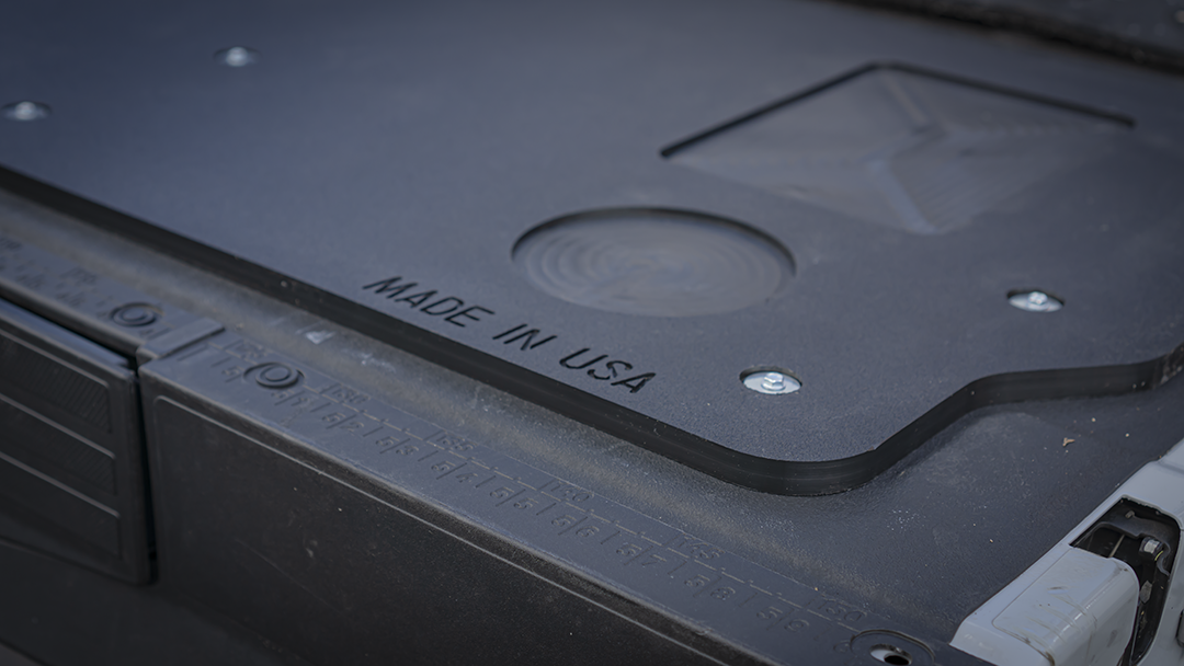 Close-up of the MADE IN USA stamp and drink holder on the Mountain Hatch 2023+ Super Duty panel