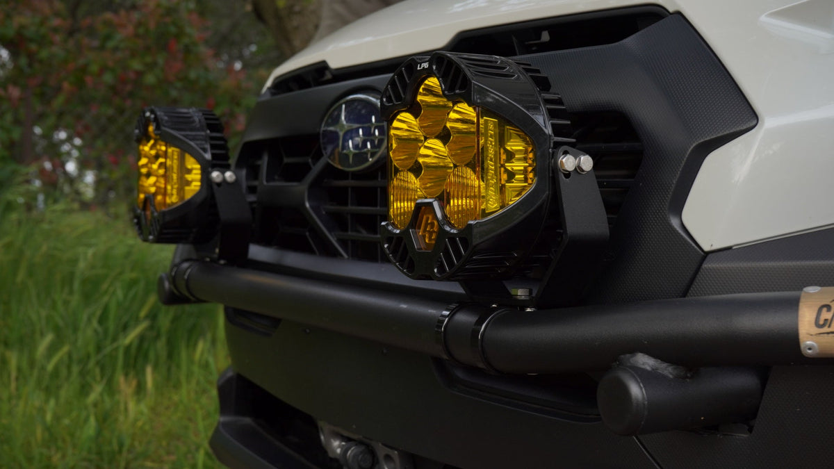 Close view of amber light pods mounted on the brush bar at the Subaru grille