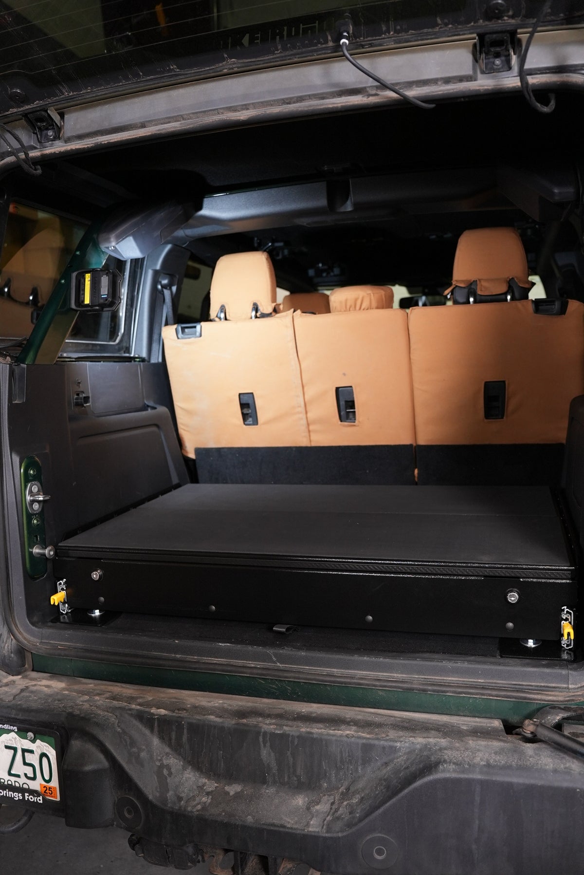 Bronco complete drawer system closed behind the folded rear seats