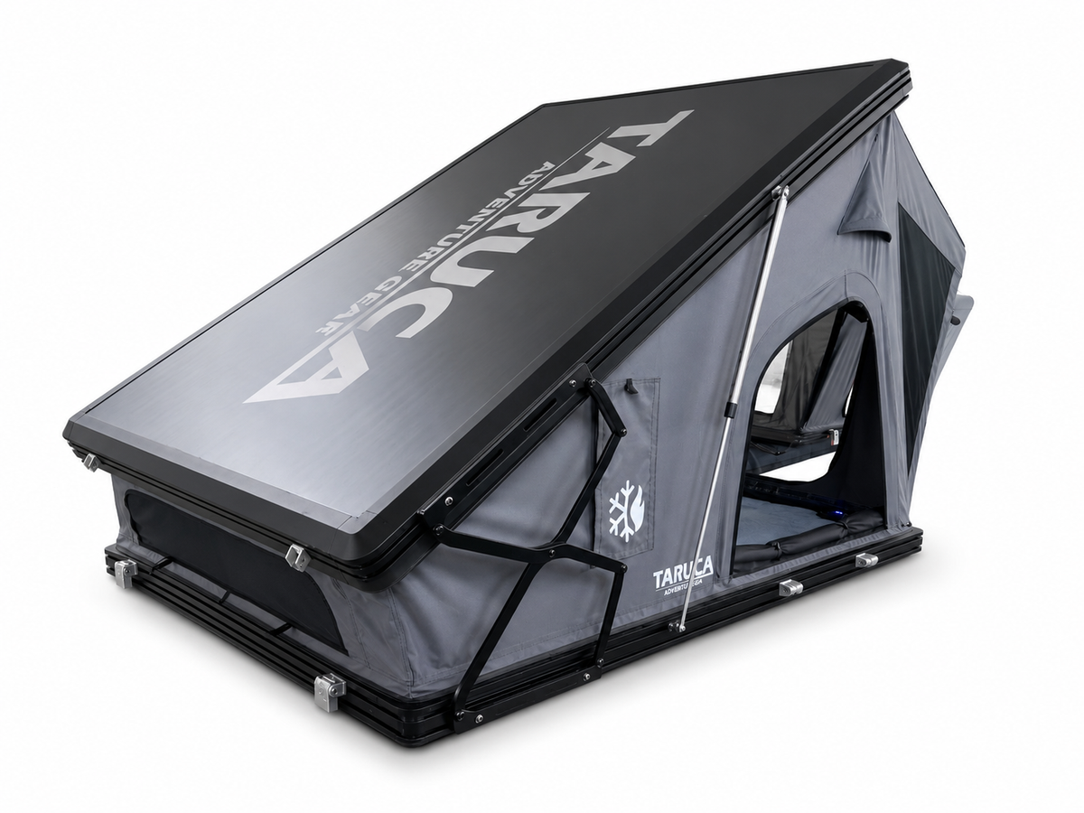 Taruca Dark Rogue rooftop tent partly open, angled view of the black hard-shell lid with Taruca logo