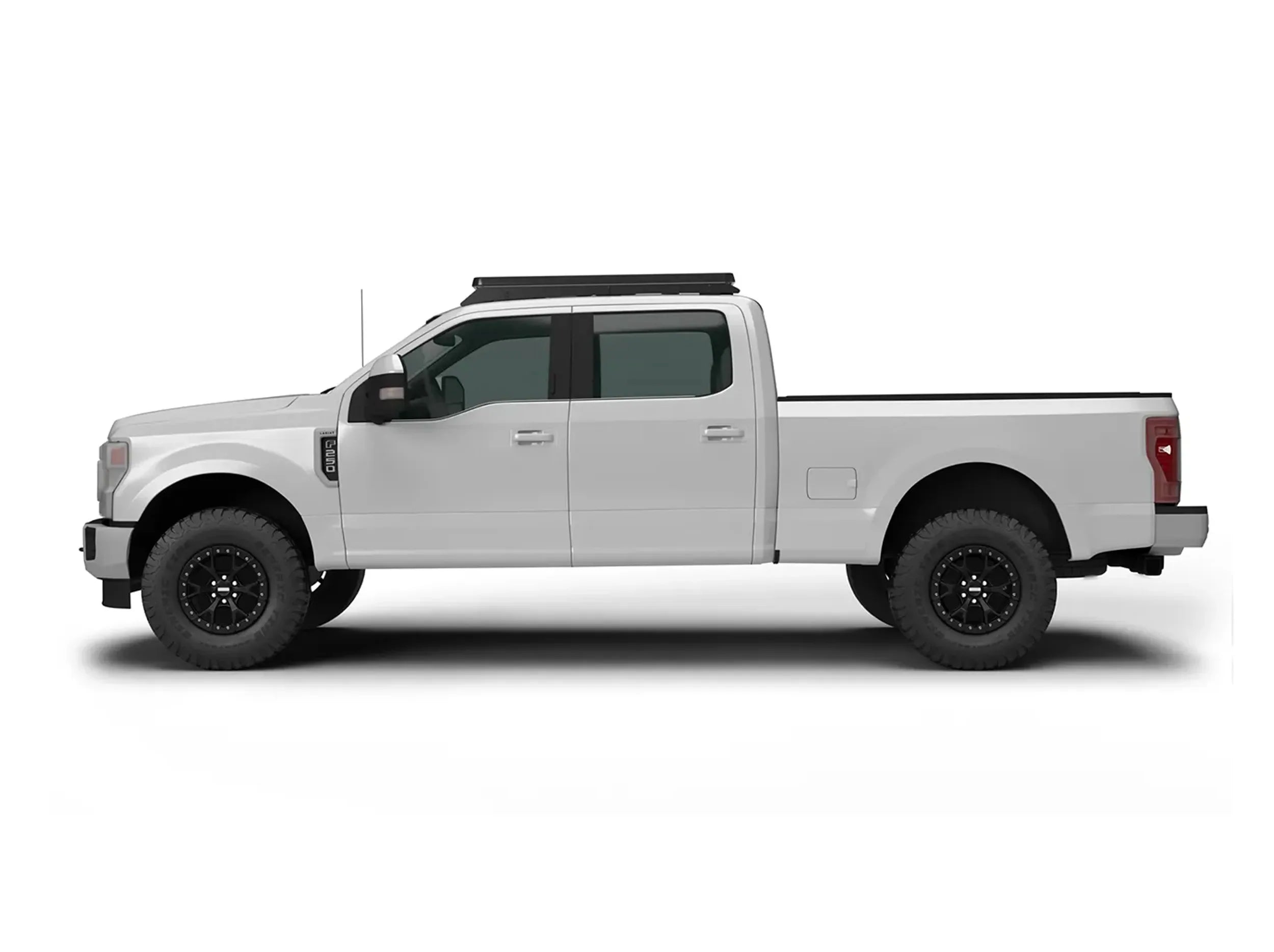 SIDE VIEW OF WHITE FORD SUPERDUTY TRUCK WITH ACS OVER CAB ROOF MOUNTED
