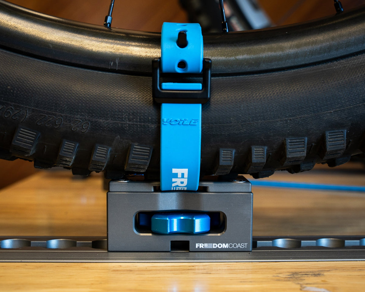 Strap Cap and strap holding a tire on a MODmount base on L-track