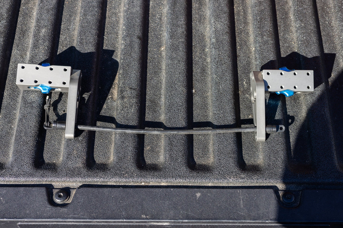 Two MODmount bases with shock cord fitted to a Toyota truck bed rail