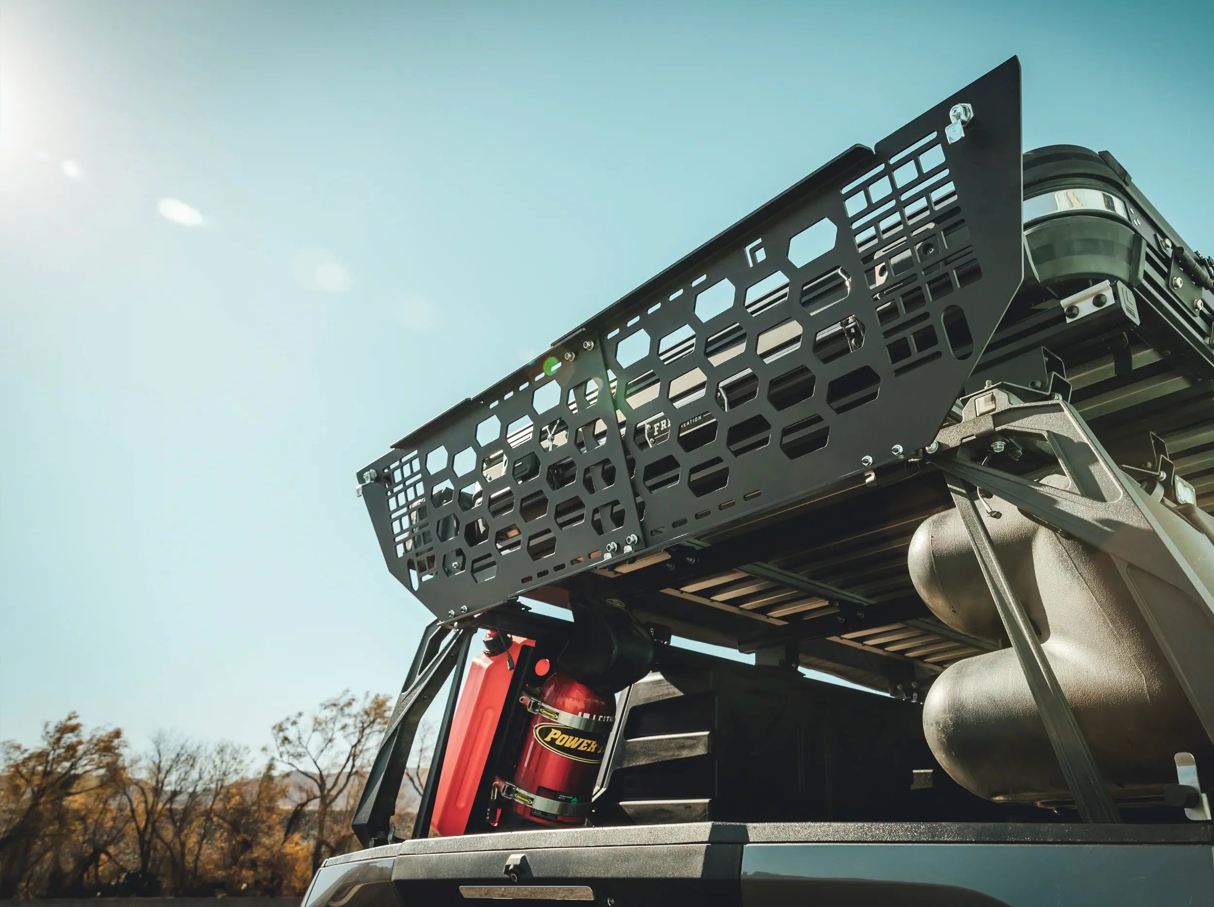REAR VIEW OPENED BLACK GATE MOUNTED ON REAR OF ACS FORGED BED RACK