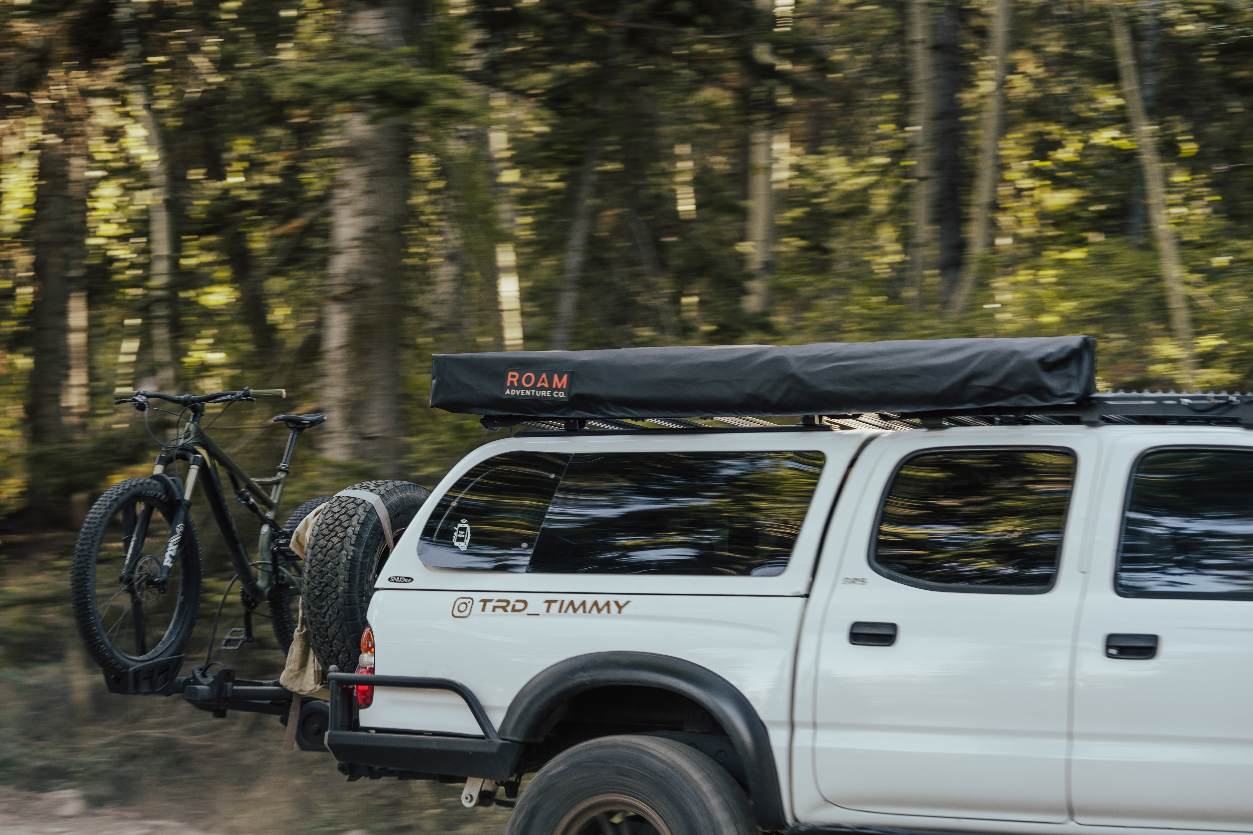ROAM ARC 270 awning deployed on a trail