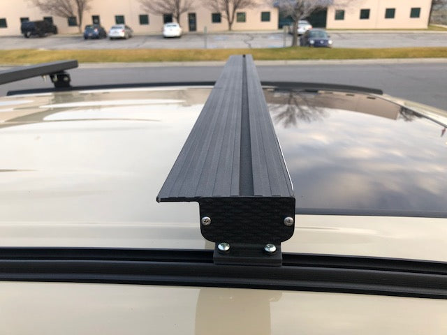 Close-up of K9 load bar end profile and mounting foot