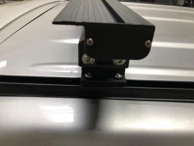 End of a K9 load bar on its mounting foot, close-up