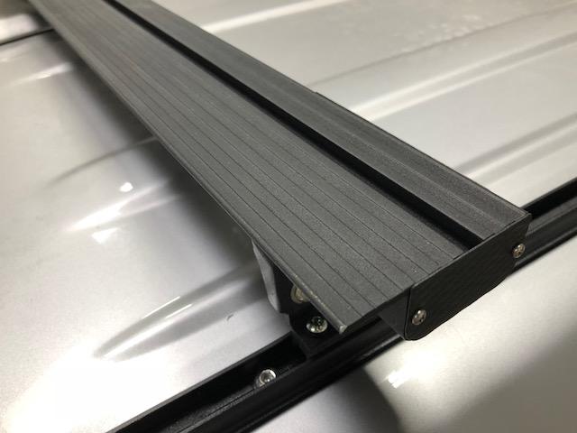K9 load bar T-slot and end cap, close-up