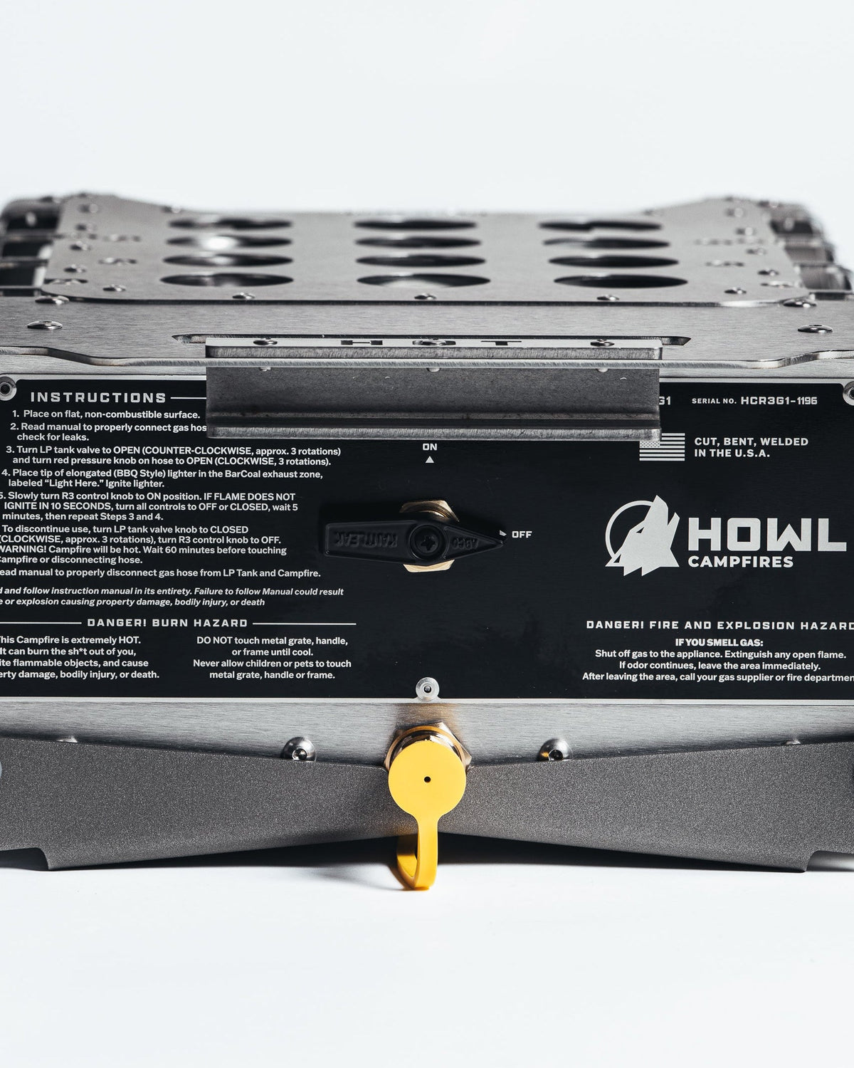 Close-up of the stamped HOT warning plate and leg hinge on the Howl R3