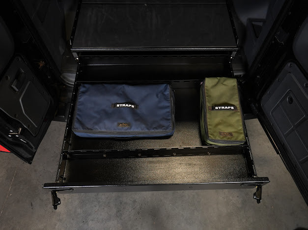 Grenadier drawer pulled out with two strap bags inside