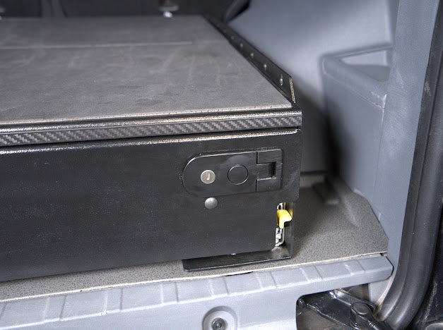 Key-locking paddle latch on the Grenadier drawer top front plate